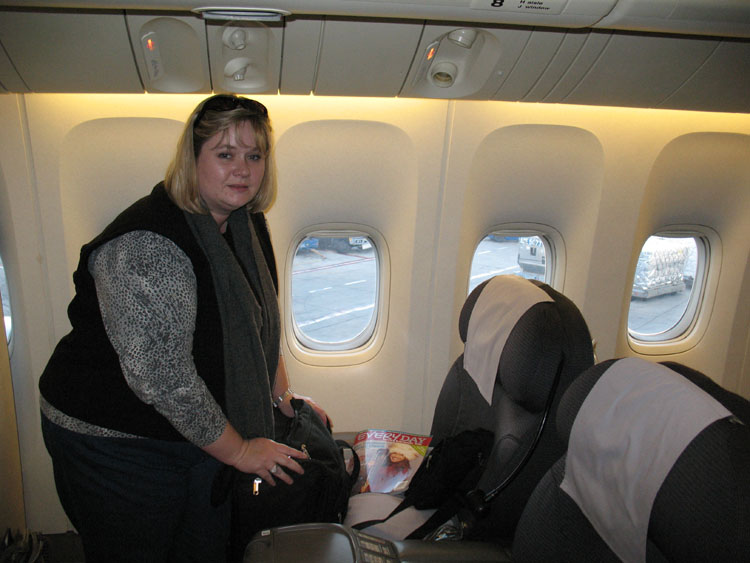 Sheila standing in the leg area of the business class seats!